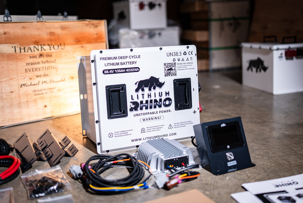 36V 105Ah Lithium Rhino kit laid out with its battery, charger, DC converter, gauge, wiring and brackets